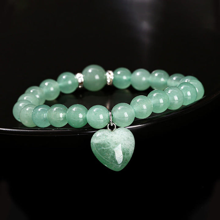 Bracelet d'équilibre en forme de cœur avec Buddha Stones et divers cristaux verts en aventurine. - image 11