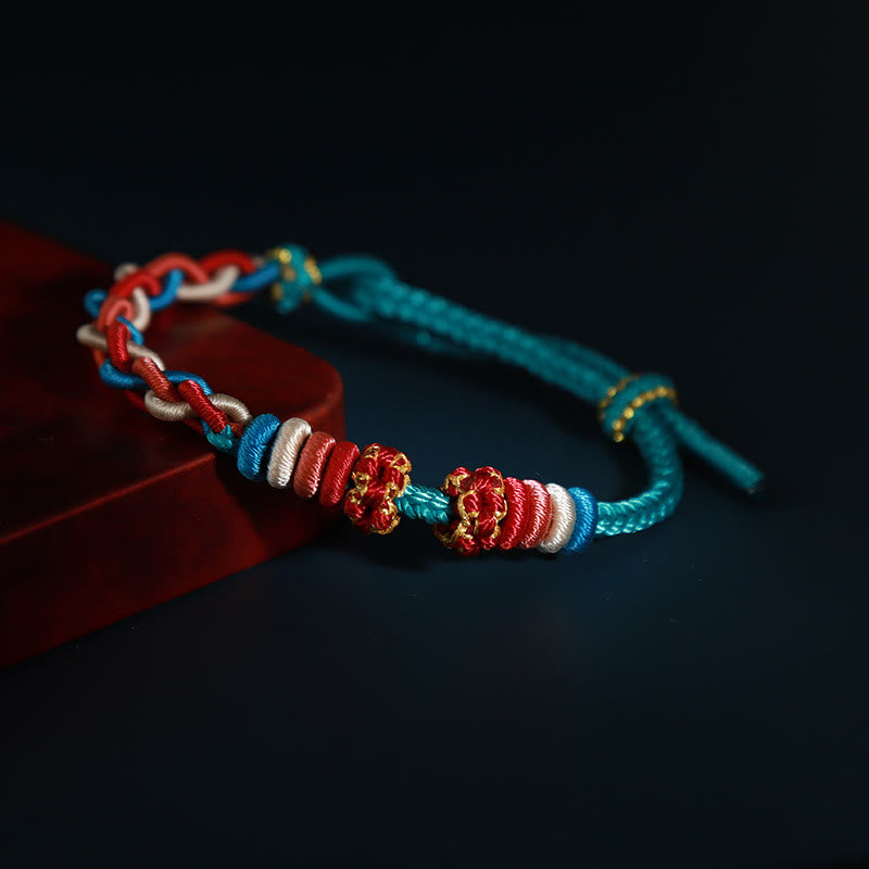 Bracelet de connexion en fleur de pêcher avec quatre Buddha Stones