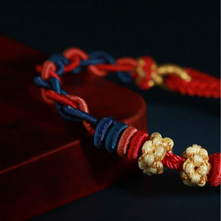 Bracelet de connexion en fleur de pêcher avec quatre Buddha Stones