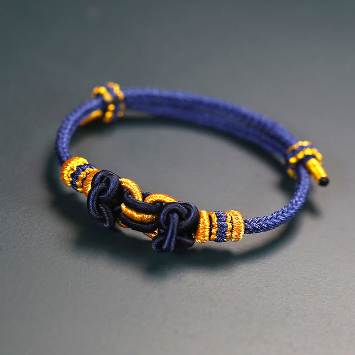 Bracelet de force en corde rouge avec nœud de selle et Buddha Stones