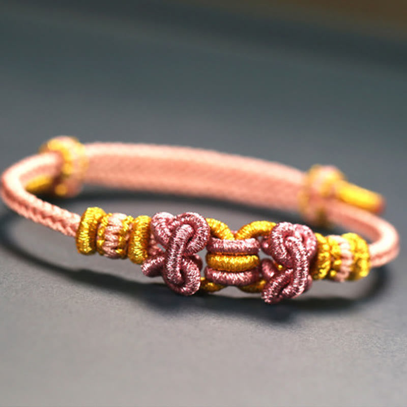 Bracelet de force en corde rouge avec nœud de selle et Buddha Stones