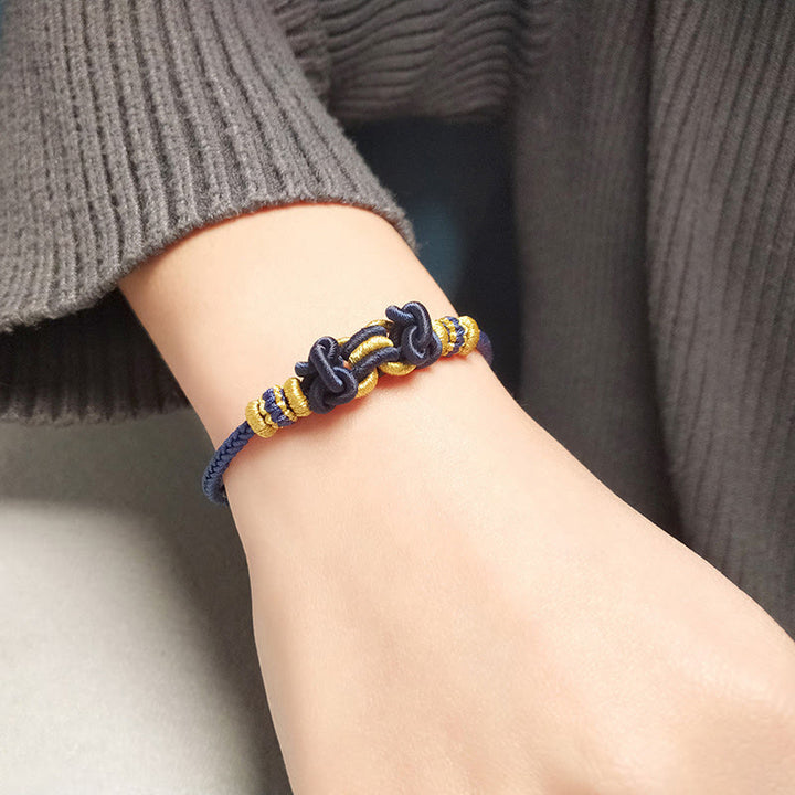 Bracelet de force en corde rouge avec nœud de selle et Buddha Stones