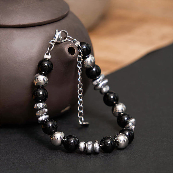 Bracelet porte-bonheur en onyx noir et Buddha Stones
