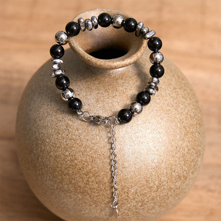Bracelet porte-bonheur en onyx noir et Buddha Stones