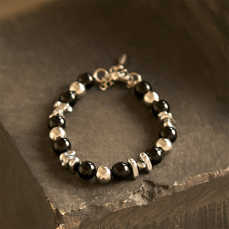 Bracelet porte-bonheur en onyx noir et Buddha Stones