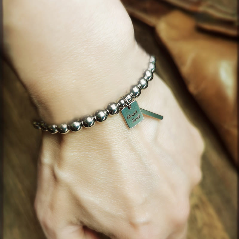 Bracelet porte-bonheur en acier titane et Buddha Stones