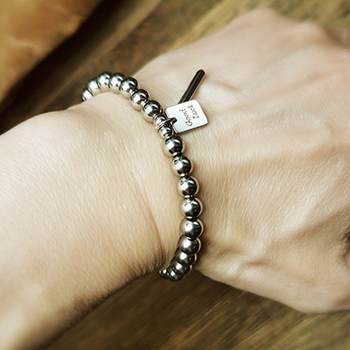 Bracelet porte-bonheur en acier titane et Buddha Stones