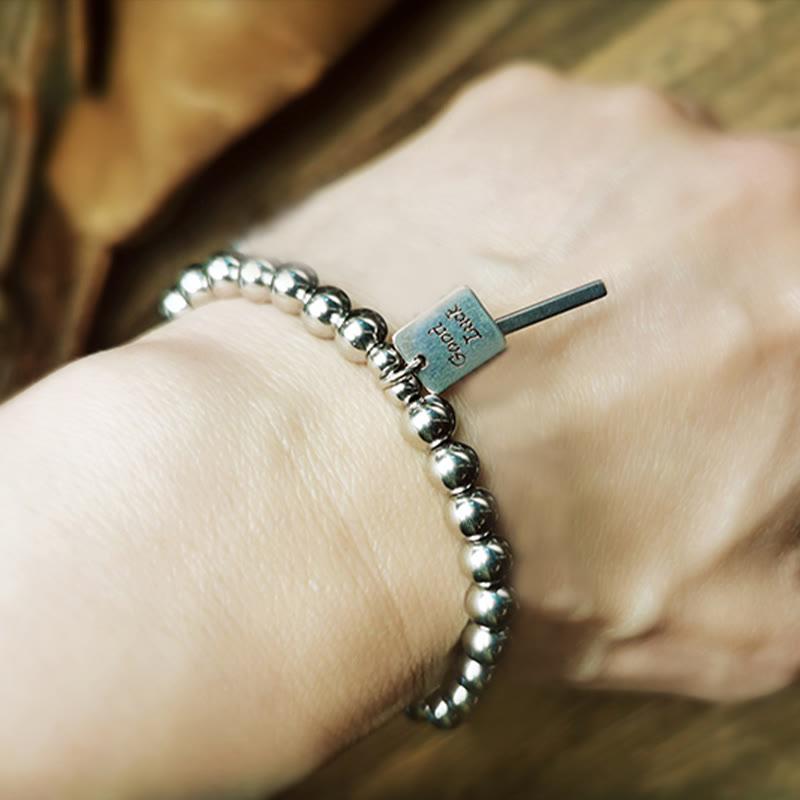 Bracelet porte-bonheur en acier titane et Buddha Stones