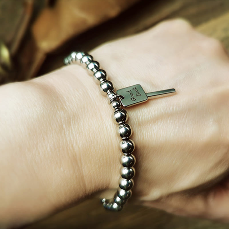 Bracelet porte-bonheur en acier titane et Buddha Stones