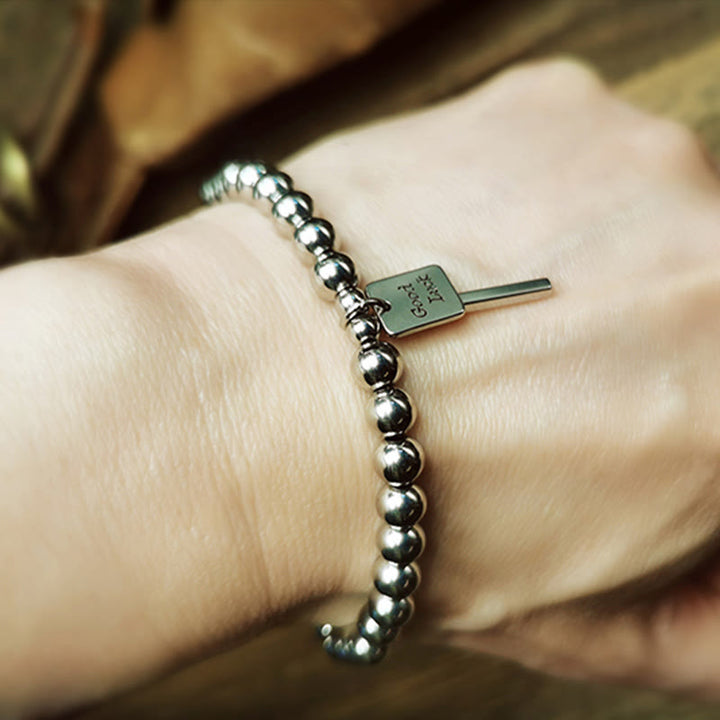 Bracelet porte-bonheur en acier titane et Buddha Stones