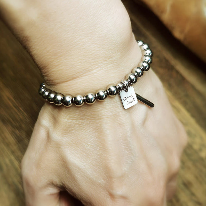 Bracelet porte-bonheur en acier titane et Buddha Stones