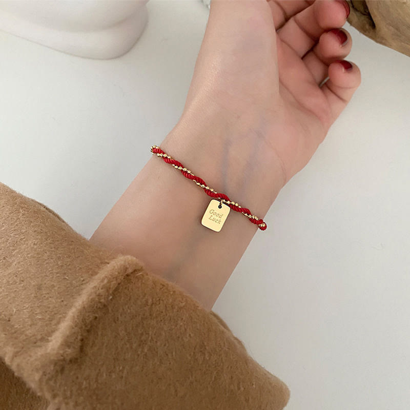 Bracelet porte-bonheur en cuivre plaqué or avec cordon rouge et Buddha Stones
