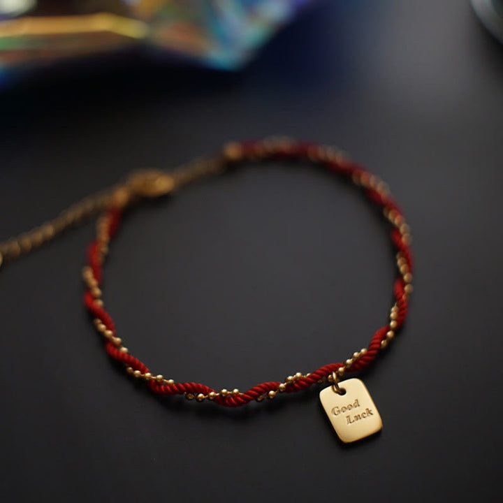 Bracelet porte-bonheur en cuivre plaqué or avec cordon rouge et Buddha Stones