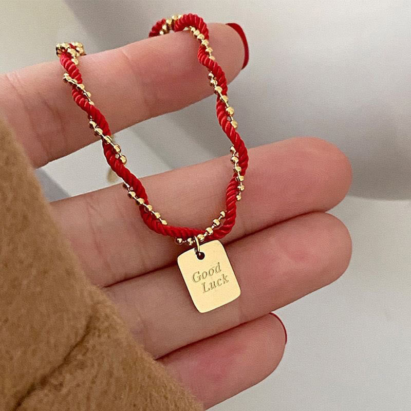 Bracelet porte-bonheur en cuivre plaqué or avec cordon rouge et Buddha Stones