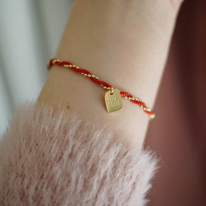 Bracelet porte-bonheur en cuivre plaqué or avec cordon rouge et Buddha Stones