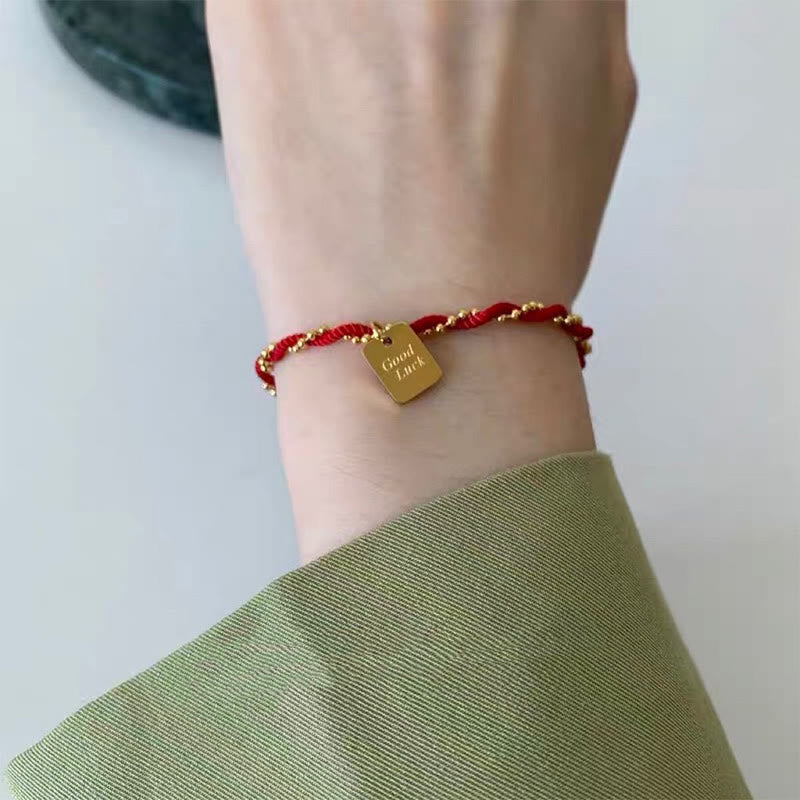 Bracelet porte-bonheur en cuivre plaqué or avec cordon rouge et Buddha Stones