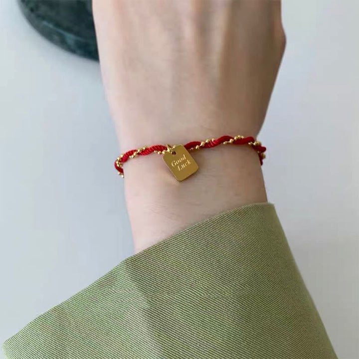 Bracelet porte-bonheur en cuivre plaqué or avec cordon rouge et Buddha Stones