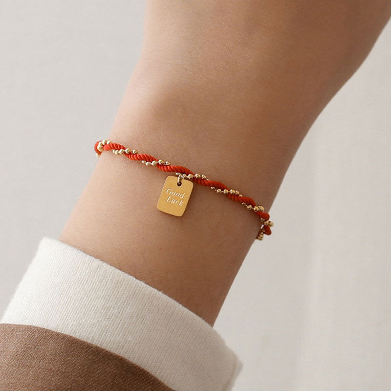 Bracelet porte-bonheur en cuivre plaqué or avec cordon rouge et Buddha Stones