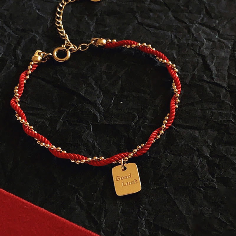 Bracelet porte-bonheur en cuivre plaqué or avec cordon rouge et Buddha Stones