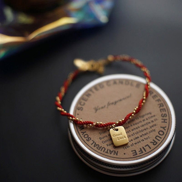 Bracelet porte-bonheur en cuivre plaqué or avec cordon rouge et Buddha Stones