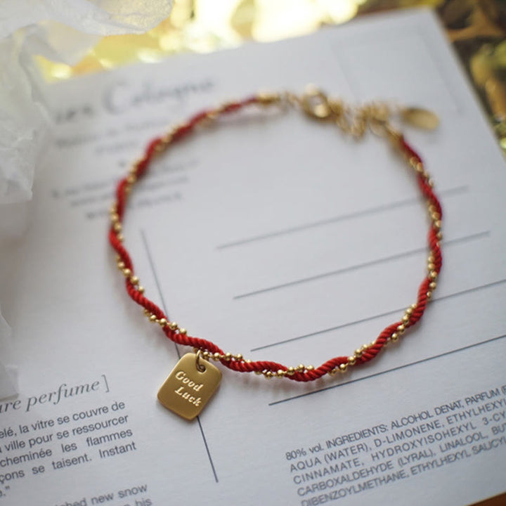 Bracelet porte-bonheur en cuivre plaqué or avec cordon rouge et Buddha Stones