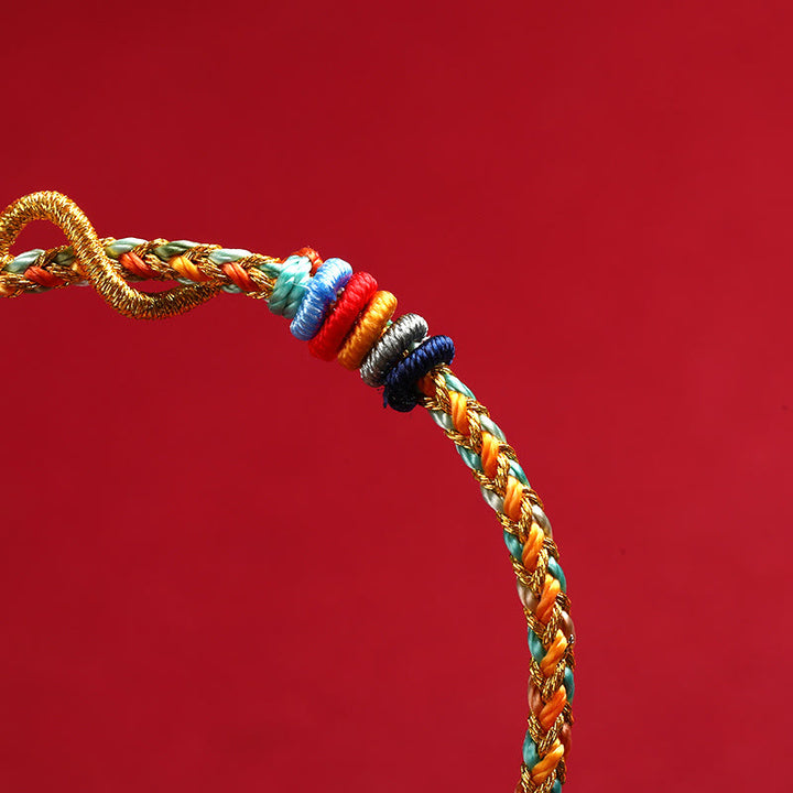 Bracelet tressé de protection de l'année du serpent avec cordon rouge et Buddha Stones