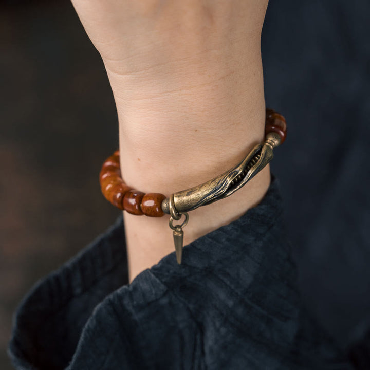Bracelet de force avec pendentif cône en cuivre et perles en Buddha Stones