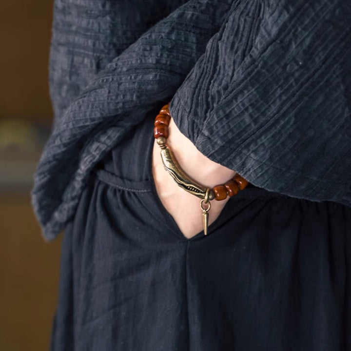 Bracelet de force avec pendentif cône en cuivre et perles en Buddha Stones