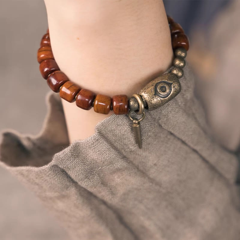 Bracelet de force avec pendentif en forme de cône en cuivre en forme de Dzi en Buddha Stones