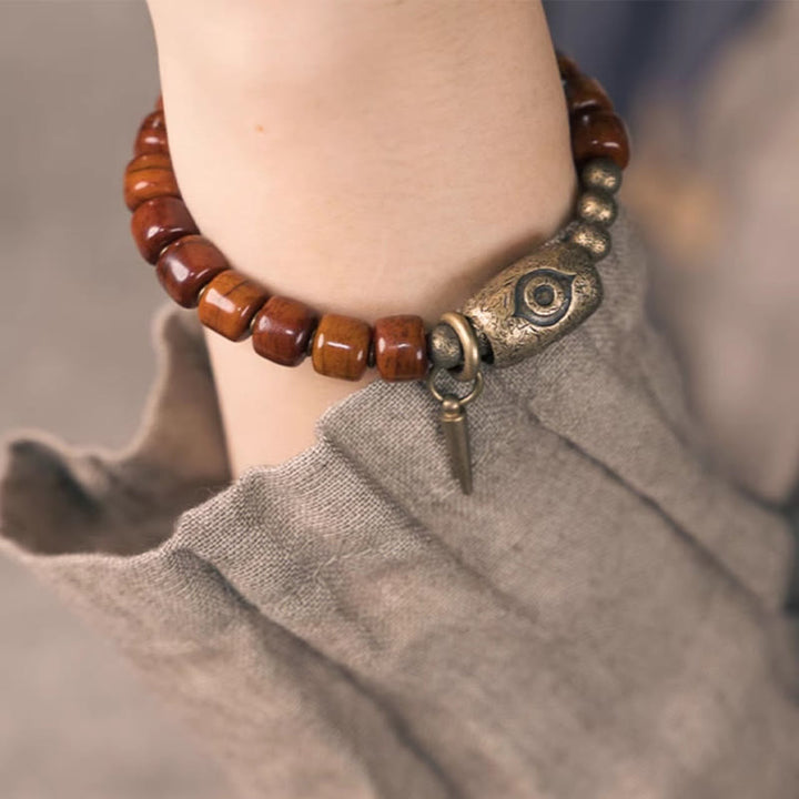 Bracelet de force avec pendentif en forme de cône en cuivre en forme de Dzi en Buddha Stones