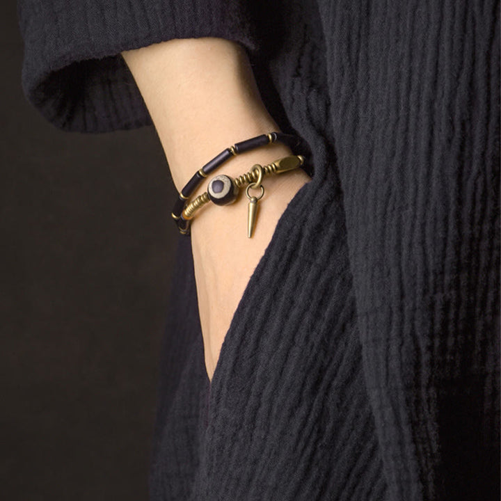 Bracelet de protection à double tour avec pendentif en forme de Buddha Stones en onyx noir et cuivre Dzi
