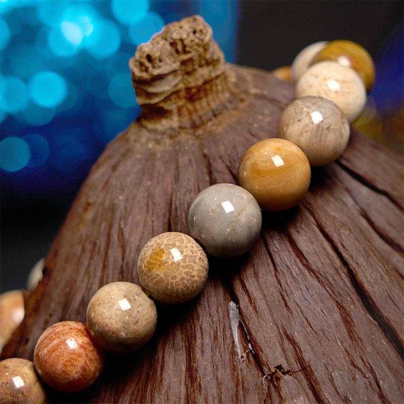 Bracelet de compassion en corail fossile Buddha Stones