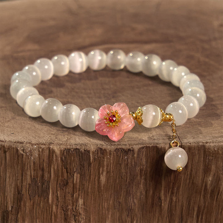 Bracelet de soutien en chrysobéryl œil de chat et fleurs roses de Buddha Stones