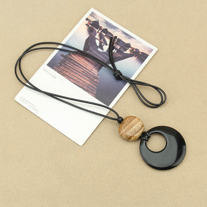 Collier pendentif en cuivre avec pierre d'image Liuli en obsidienne noire et Buddha Stones
