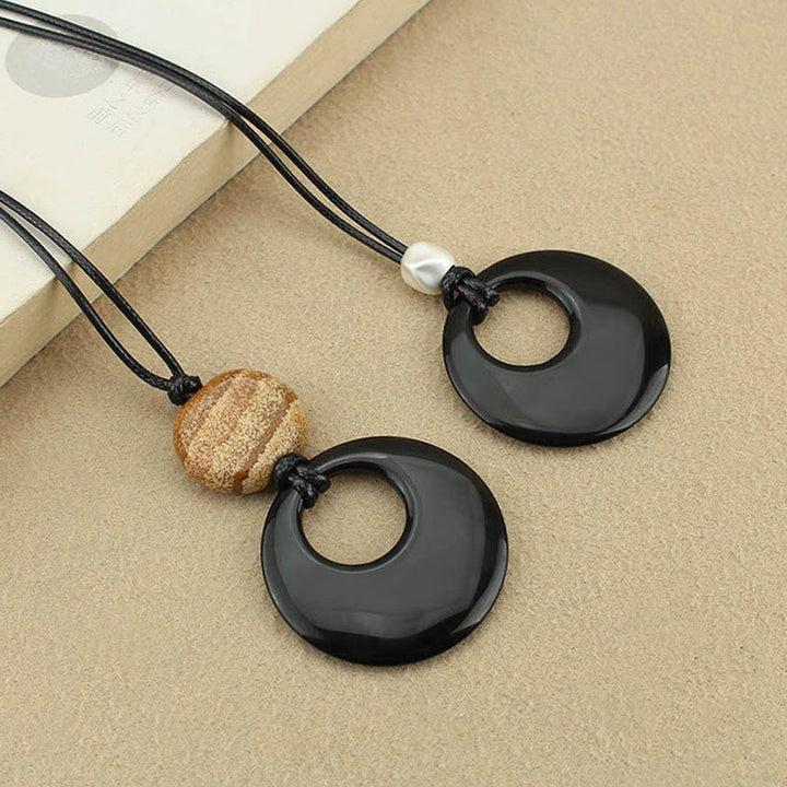Collier pendentif en cuivre avec pierre d'image Liuli en obsidienne noire et Buddha Stones