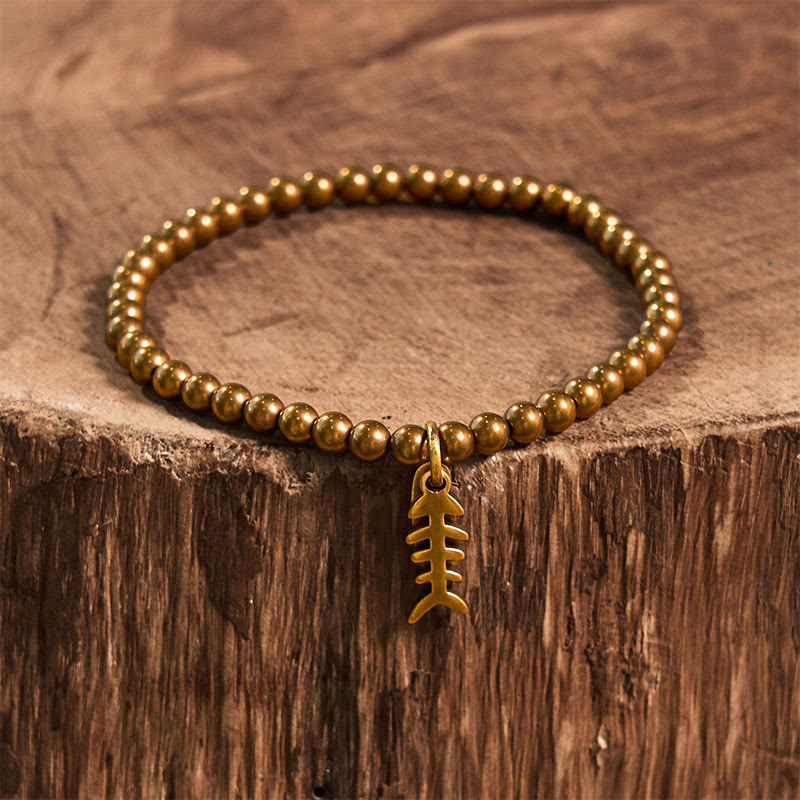 Bracelet de guérison en arête de poisson en cuivre et Buddha Stones