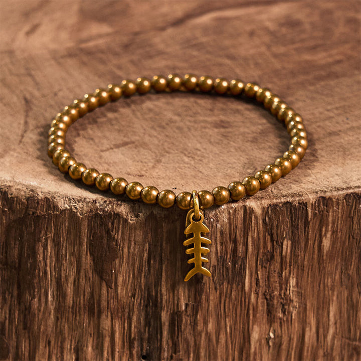 Bracelet de guérison en arête de poisson en cuivre et Buddha Stones