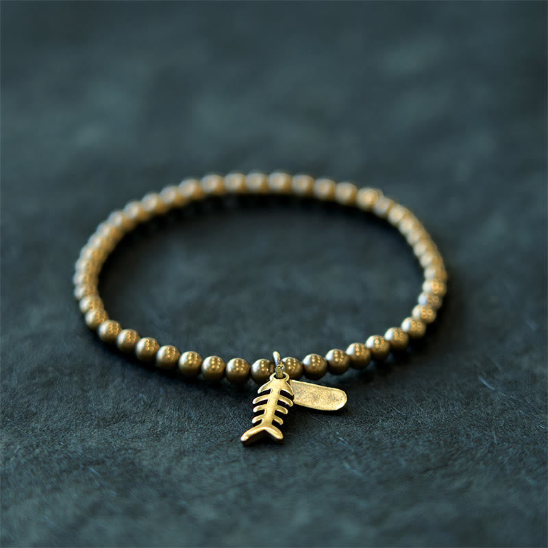 Bracelet de guérison en arête de poisson en cuivre et Buddha Stones