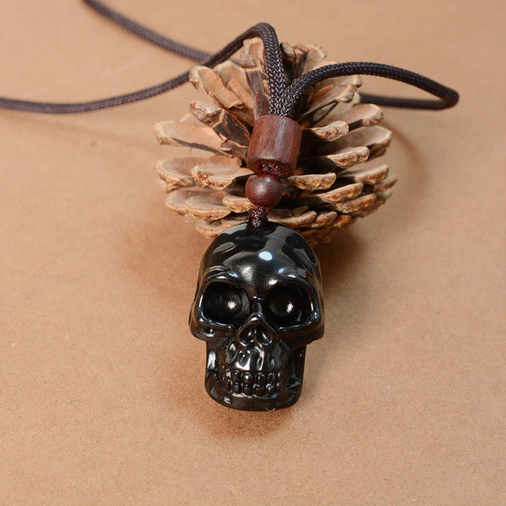 Collier pendentif en obsidienne noire avec Buddha Stones et squelette Shmashana