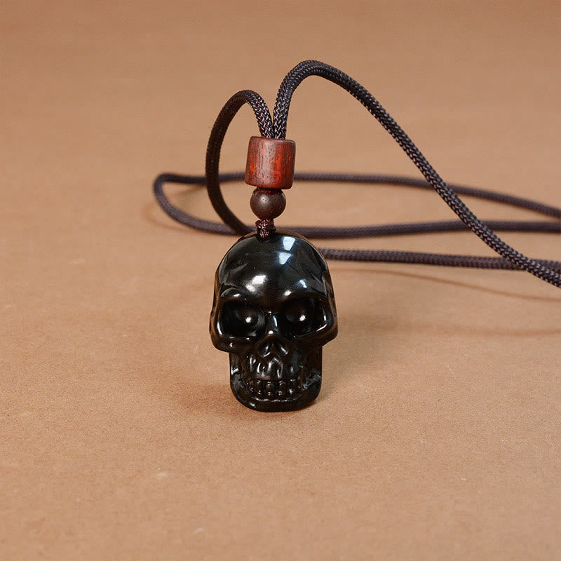 Collier pendentif en obsidienne noire avec Buddha Stones et squelette Shmashana