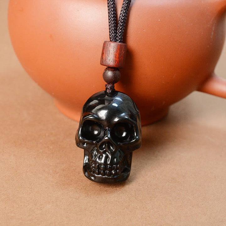 Collier pendentif en obsidienne noire avec Buddha Stones et squelette Shmashana