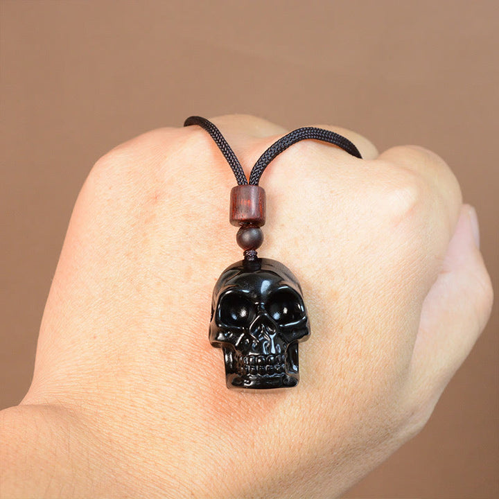 Collier pendentif en obsidienne noire avec Buddha Stones et squelette Shmashana