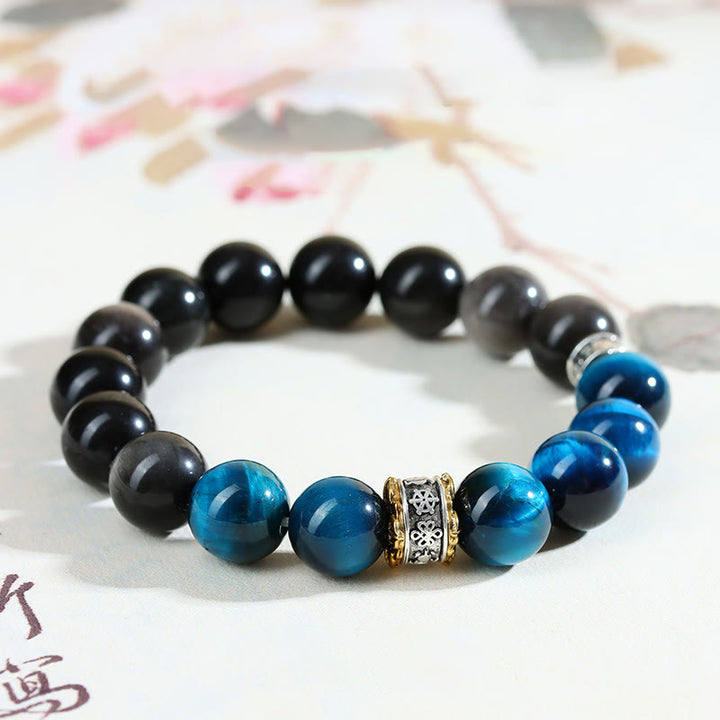 Bracelet de force en obsidienne argentée et œil de tigre bleu Buddha Stones