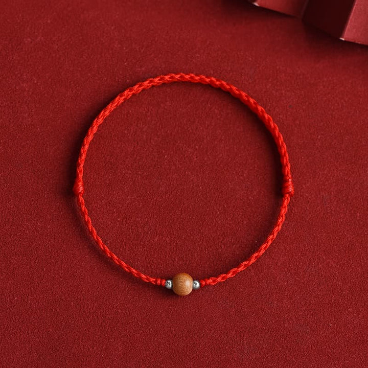 Bracelet de cheville tressé en perles de bois de pêcher naturelles de Buddha Stones