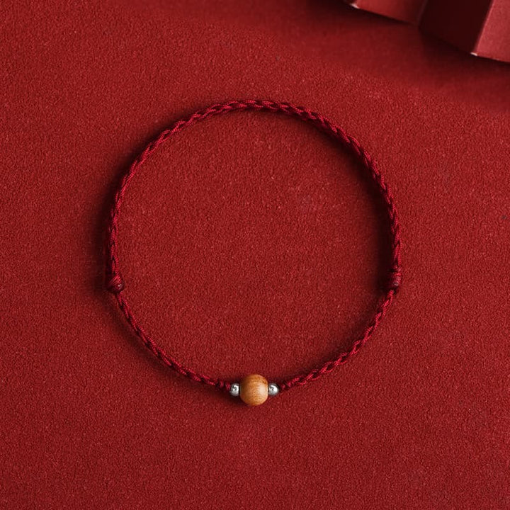 Bracelet de cheville tressé en perles de bois de pêcher naturelles de Buddha Stones