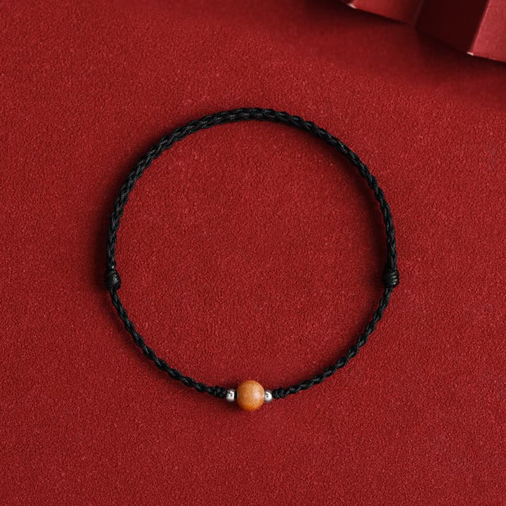 Bracelet de cheville tressé en perles de bois de pêcher naturelles de Buddha Stones