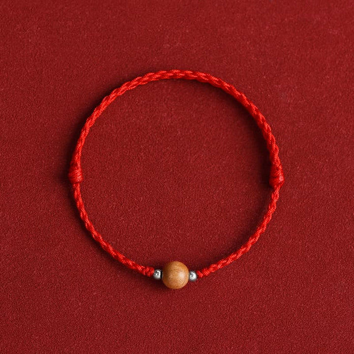 Bracelet de cheville tressé en perles de bois de pêcher naturelles de Buddha Stones