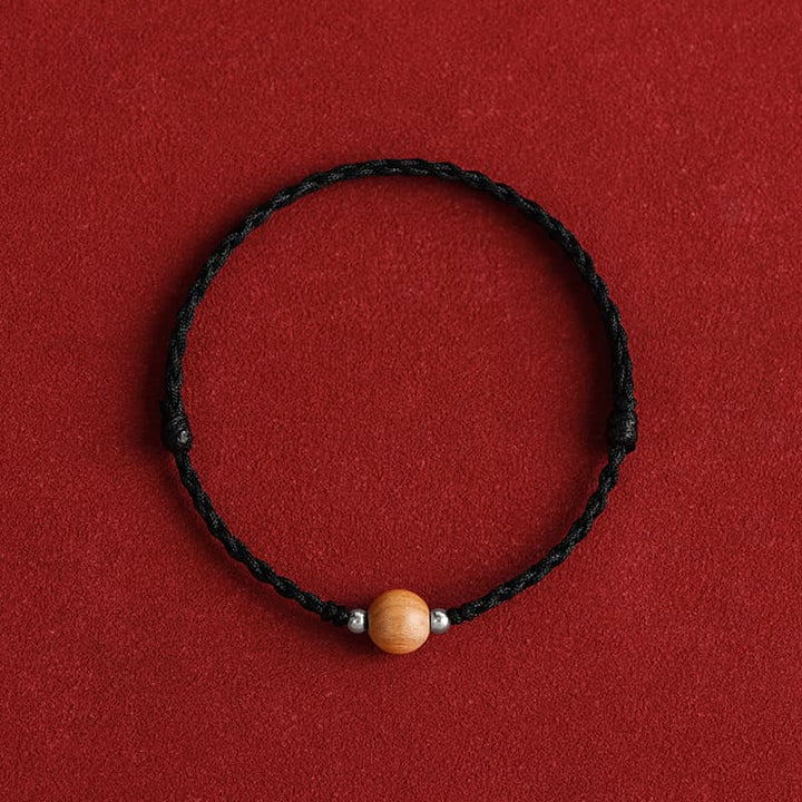 Bracelet de cheville tressé en perles de bois de pêcher naturelles de Buddha Stones