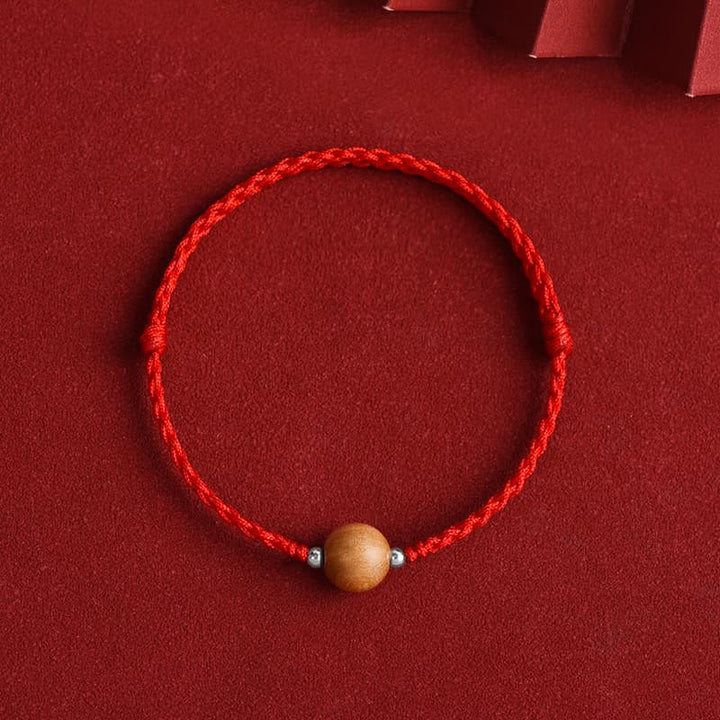 Bracelet de cheville tressé en perles de bois de pêcher naturelles de Buddha Stones