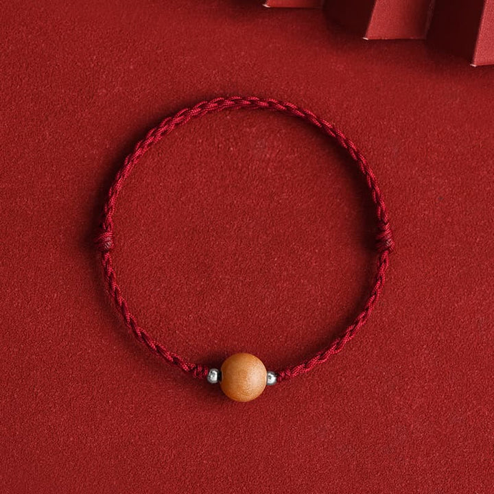 Bracelet de cheville tressé en perles de bois de pêcher naturelles de Buddha Stones